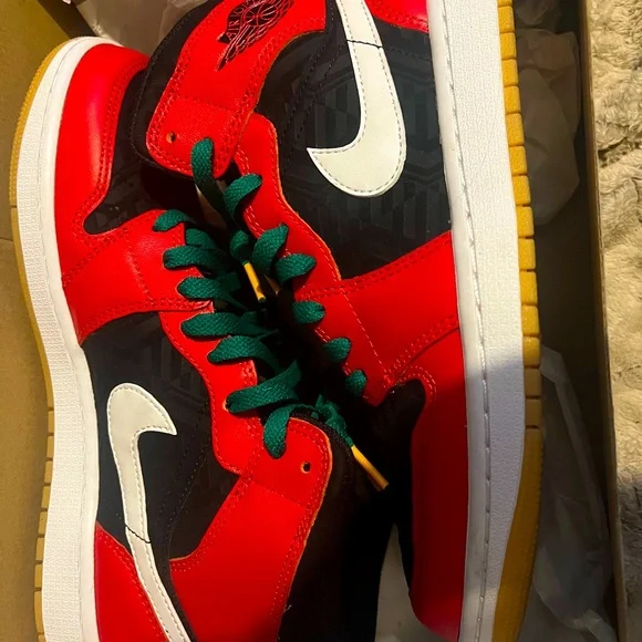 Christmas Jordan 1 they are red,black,and white with green laces and gum bottoms